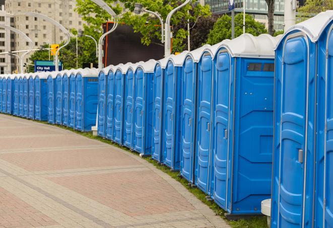 a row of portable restrooms at an outdoor special event, ready for use in Cornelius